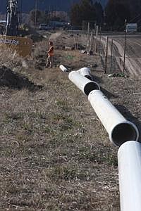 The new ten inch pipes are lines across the ground to replace the old eight inch pipes.