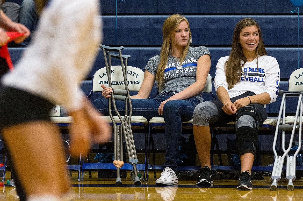 &lt;p&gt;SHAWN GUST/Press Missy Huddleston, left, and Megan Ramseyer, both injured, watch Coeur d&#146;Alene High&#146;s September 17 match against Lake City from the bench.&lt;/p&gt;