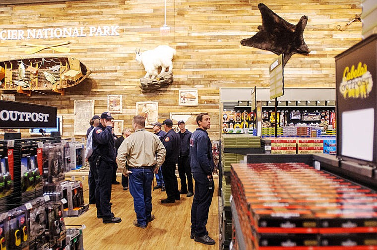 &lt;p&gt;Kalispell Fire Department members check out the Glacier National Park wall Thursday morning during a tour of the new Cabela's Outpost store in Kalispell. Oct. 24, 2013 in Kalispell, Montana. (Patrick Cote/Daily Inter Lake)&lt;/p&gt;