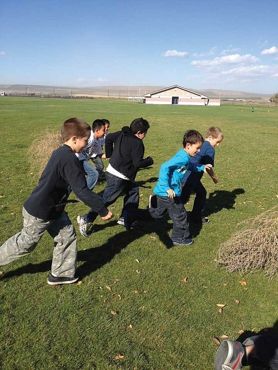 Red Rock Elementary School students decided to race the wind on the windiest day in Royal City last week. They lined up with a tumbleweed and then tried to outrun it.