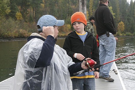 &lt;p&gt;Post Falls Troop 13 Scoutmaster Matt McKoon (left) teaches Cub Scout Tristan Wright, 7, of Spokane, the finer points of casting a fishing pole on Saturday at Camp Easton. The camp hosted several hundred people for Trailblazer Activity Day.&lt;/p&gt;