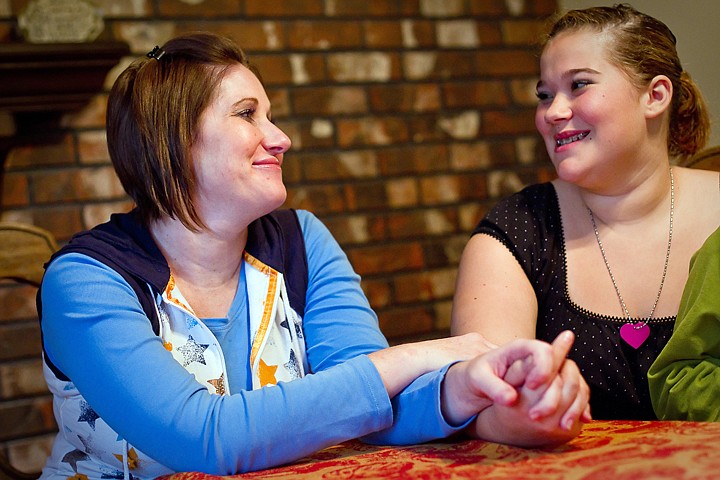 &lt;p&gt;Jackie Gering, left, and her daughter Kia Gering, 14, hold hands as they discuss Kia's three-night ordeal after becoming stranded in the St. Joe Forest 35 miles southeast of Avery on a hunting trip with her father Matt Gering. The two were located by a search and rescue helicopter Wednesday morning on a remote road near Mammoth Springs.&lt;/p&gt;