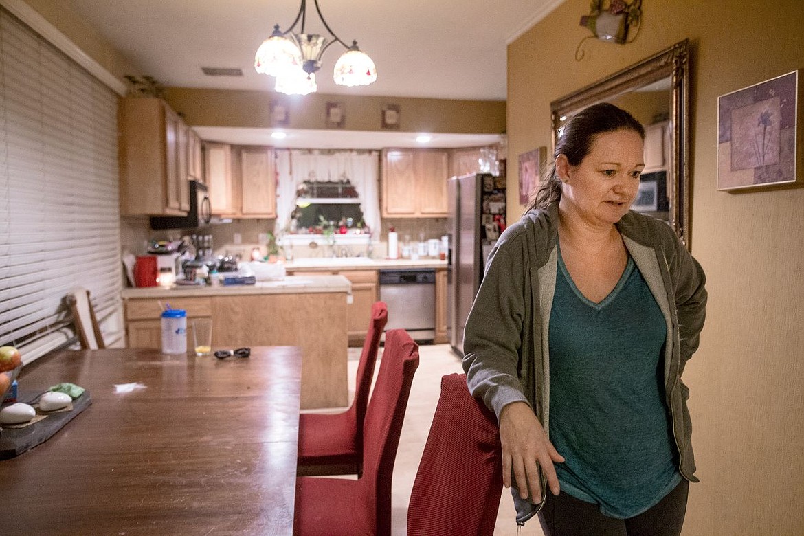 &lt;p&gt;Laura Quesnell stands in the dining area of her home on Tuesday where she has experience multiple strange and out-of-the-ordinary events, such as dogs not wanting to go into the kitchen and staring at the wall, to doors being opened and dog food thrown onto the floor for no apparent reason.&lt;/p&gt;