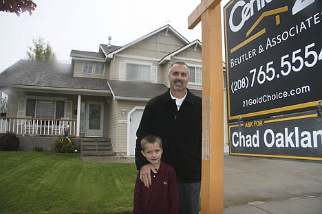 &lt;p&gt;Tim Burnside, with son Ryan, pose Thursday outside their Coeur d'Alene home. Burnside has had the home on the market for around three weeks, and could walk away with a profit should it sell for the asking price.&lt;/p&gt;