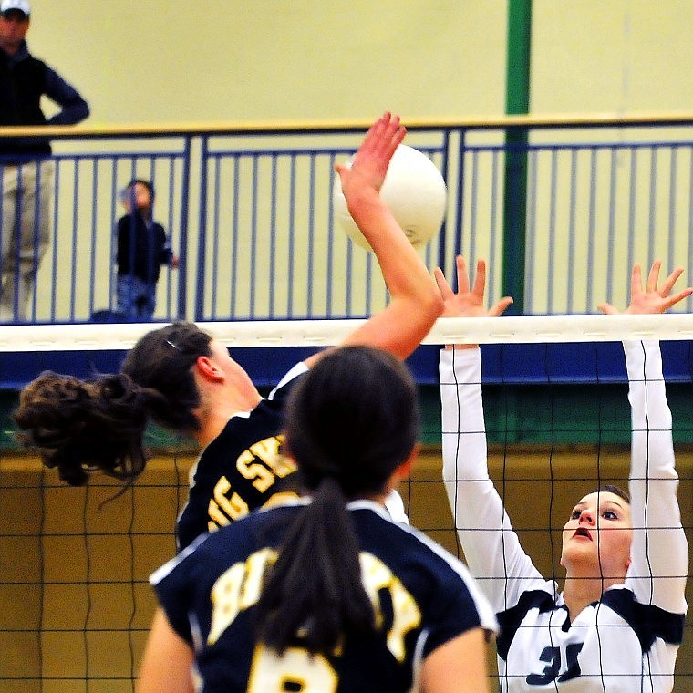 Glaciers Cassi Hashley puts her hands up at the net to block a shot by Missoula Big Skys Ellen Wolfermans spike.