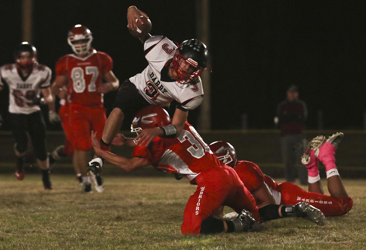 &lt;p&gt;Arlee's George Shick tackles a Darby player on Friday night in Arlee.&lt;/p&gt;