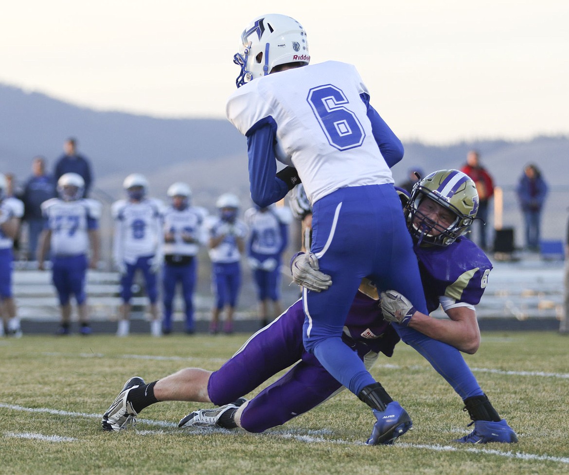 &lt;p&gt;Polson's Matt Rensvold tackles Havre's Dane Warp during the first quarter on Friday night.&lt;/p&gt;