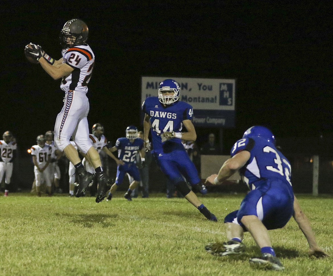 &lt;p&gt;Ronan's Trevor Anderson jumps up for a catch against Mission on Friday night.&lt;/p&gt;