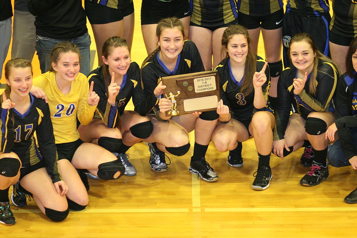 <p>Some Libby High volleyball players are pictured with their district tournament plaque on Saturday, Oct. 29.</p>