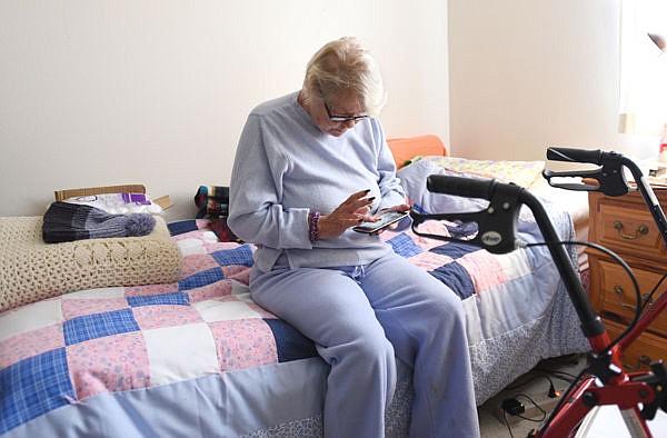 &lt;p&gt;Charlotte Diane Armstrong plays Mahjongg in her room at the Samaritan House in Kalispell on Tuesday. Armstrong has been living at the house for about two months but will be moving to Langston's Adult Foster Home at the beginning of November. (Aaric Bryan/Daily Inter Lake)&lt;/p&gt;