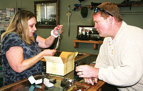 &lt;p&gt;Clint Robertson, who finished second last January on &quot;The Apprentice,&quot; Donald Trump's reality business contest show, buys coins and jewelry from Post Falls' Anita Whitmore at the Coeur d'Alene pawn shop Robertson purchased. After speaking for Trump associates and living in Florida for the past several months, Robertson and his family have moved back to Post Falls.&lt;/p&gt;