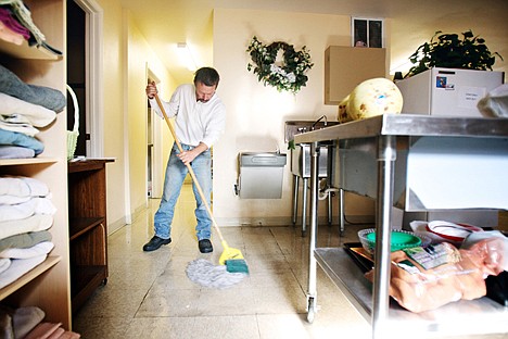 &lt;p&gt;Dennis Hardwick mops the floors of Fresh Start in Coeur d'Alene after the facility closed for the day Wednesday. Hardwick, who has been homeless after being laid off from his construction job, volunteers his time at Fresh Start as a way of giving back the organization where he receives assistance.&lt;/p&gt;