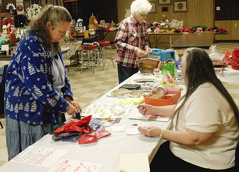 &lt;p&gt;Vendor Pat McDougal purchases her lunch from Meralise Nass at the VFW bazaar on Saturday in Plains. Monday raised helped fund the organization cancer effort and general fund.&lt;/p&gt;