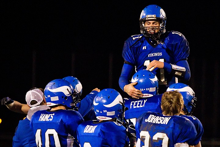 &lt;p&gt;Coeur d'Alene High quarterback Chad Cahlich is hoisted in the air by Brandon Feely after Friday's 19-14 victory over Lake City.&lt;/p&gt;