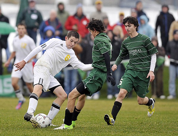 &lt;p&gt;Whitefish junior Tommy Murphy (6) keeps the ball away from Billings Central defenders during the Class A Boys State Soccer Championship game on Saturday, October 27, in Whitefish. Whitefish won the game 4-1.&lt;/p&gt;