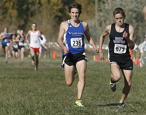 KATHERINE JONES/The Idaho Statesman
&lt;p&gt;Cody Curtis, left, of Coeur d'Alene, beats out Justin Ross from Rocky Mountain at the finish line to take third place in the state 5A cross country meet at Eagle Island State Park.&lt;/p&gt;