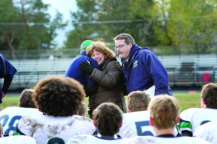 &lt;p&gt;In front of a gathering of Glacier Wolfpack players, Bridget Byrnes hugs Glacier JV coach Kyle Kercher after her son&#146;s touchdown run. At right is coach Tracy Moon.&lt;/p&gt;