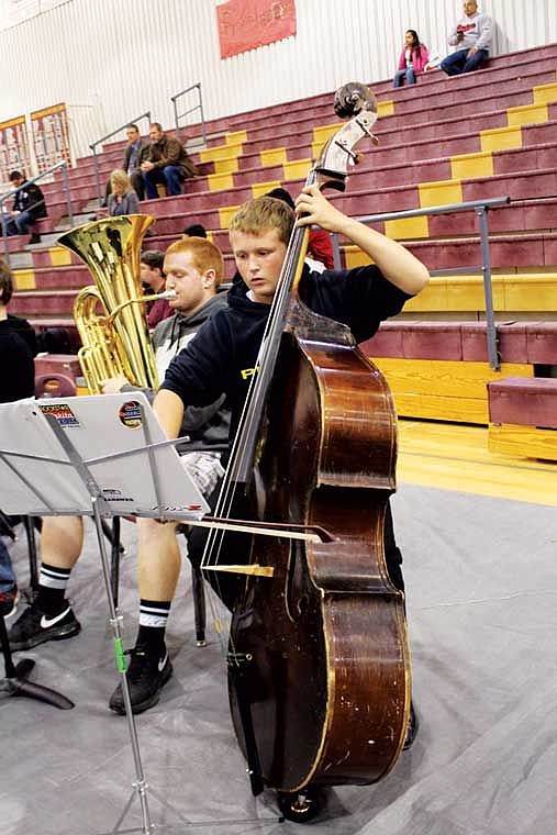 The string and brass section of the middle school Honor Festival band rehearses prior to Tuesday's concert. The biannual concert was held in Moses Lake for the first time since 2006.