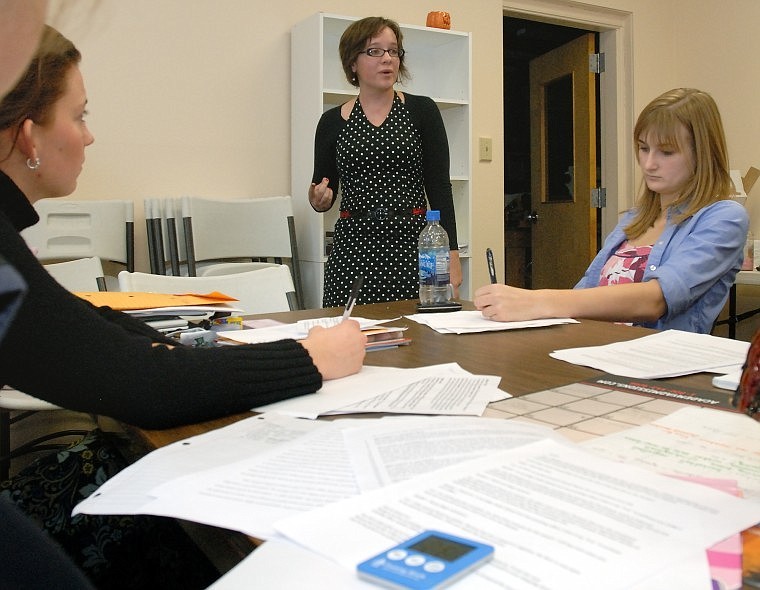 Flathead High School senior Melissa-Nichole Hermes, center, goes through her bill affirmation points as speech and debate coach Kala Lougheed, left, and junior MacKenzie Weber take notes in a legislative debate practice round at the school Tuesday afternoon. The Kalispell Kickoff Speech and Debate Tournament is at Flathead High today.