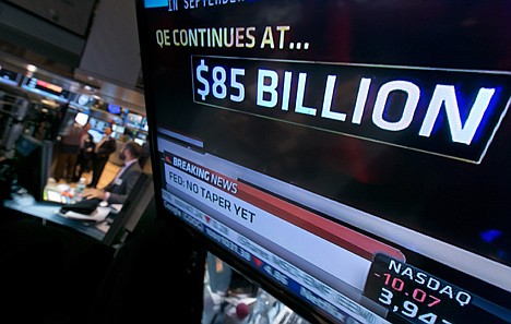 &lt;p&gt;The decision of the Federal Reserve appears on a television screen on the floor of the New York Stock Exchange Wednesday, Oct. 30, 2013. The Fed says in a statement after a two-day policy meeting that it will keep buying $85 billion a month in bonds to keep long-term interest rates low and encourage more borrowing and spending. (AP Photo/Richard Drew)&lt;/p&gt;