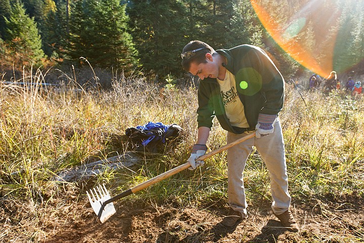 &lt;p&gt;SHAWN GUST/Press Eric Randall, sophomore Outdoor Pursuits student, works on cutting a new trail at Blue Creek Bay Recreation Area with other North Idaho College students.&lt;/p&gt;