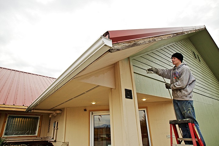 &lt;p&gt;JEROME A. POLLOS/Press Renden Clark, 16, tries his hand at using a spray gun to paint a gable Friday at the Post Falls Senior Center. The teenager, with the help of friends and family he recruited, painted the exterior of the facility for his Eagle Scout project.&lt;/p&gt;