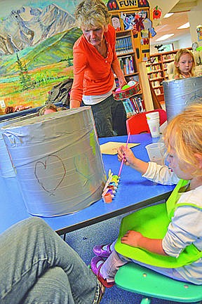 &lt;p&gt;The library&#146;s Andrea Dunn reads Jungle Drums and helps the children make drums.&lt;/p&gt;