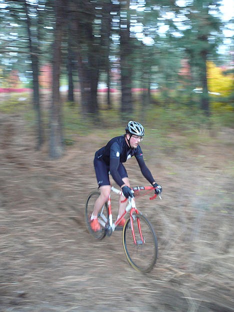 <p>Coeur dAlene resident Vance Orr flies from a treed section of the Coeur dAlene cyclocross course.</p>