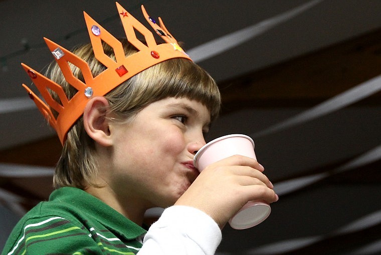 Silas Schwarz takes a drink in between playing games and participating in arts and crafts.