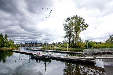 <p>A flock of geese fly over Scott Fredrick and Johnny and Chloe Gregg of Coeur d'Alene on Friday, Oct. 7, 2016 at the Blackwell Island boat launch along the Spokane River. The recreation area will close for the season Tuesday and reopen just before Memorial Day weekend in May.</p>