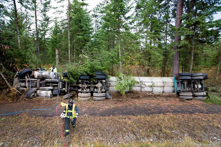 &lt;p&gt;Northern Lakes Firefighter Michael Avilla carries the jaws of life away from an overturned tanker truck full of raw sewage on Wednesday, Oct. 5, 2016 on the northbound, right-hand shoulder of Highway 95, just north of Lancaster Road. The 53-year-old driver drifted off the road while driving northbound around 9:15 a.m. The driver died on scene. The cause of the crash is under investigation.&lt;/p&gt;