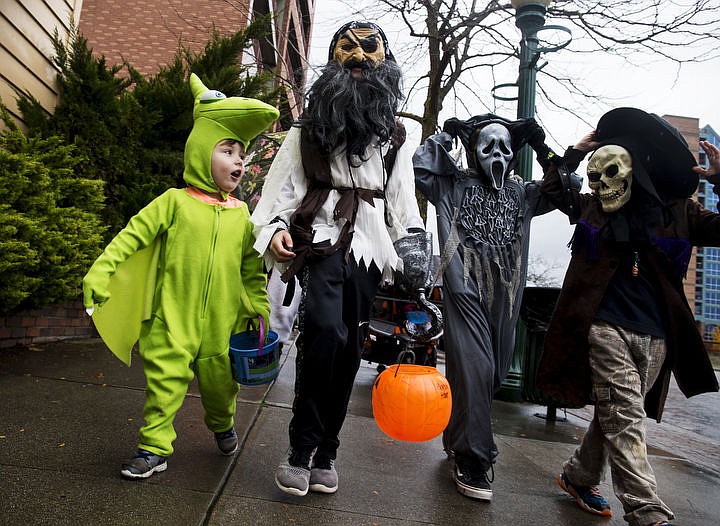 &lt;p&gt;From left, Sam Hunt, Jordan Hunt, Riley Frazier and Tristan Slaughter parade through downtown Coeur d'Alene on Monday, Oct. 31, 2016 with other Sorensen Elementary students prior to Halloween night to show thanks and support for downtown businesses.&lt;/p&gt;