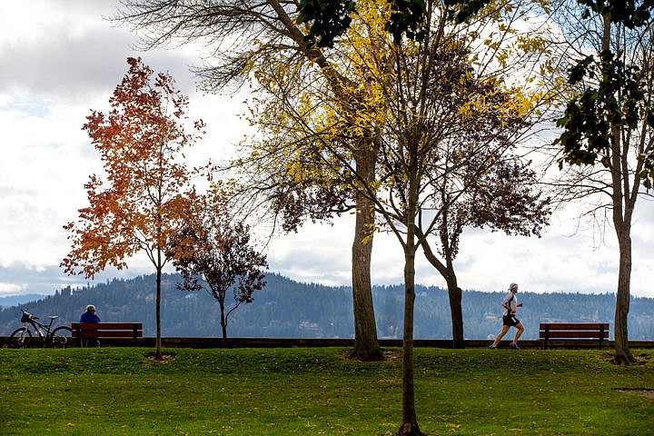 &lt;p&gt;A man relaxes on a bench to enjoy a view of Lake Coeur d'Alene as another jogs by on Monday, Oct. 10, 2016 in City Park in Coeur d'Alene. The weather is forecasted to remain crisp and dry until Wednesday, while Thursday brings rain throughout the rest of the week.&lt;/p&gt;