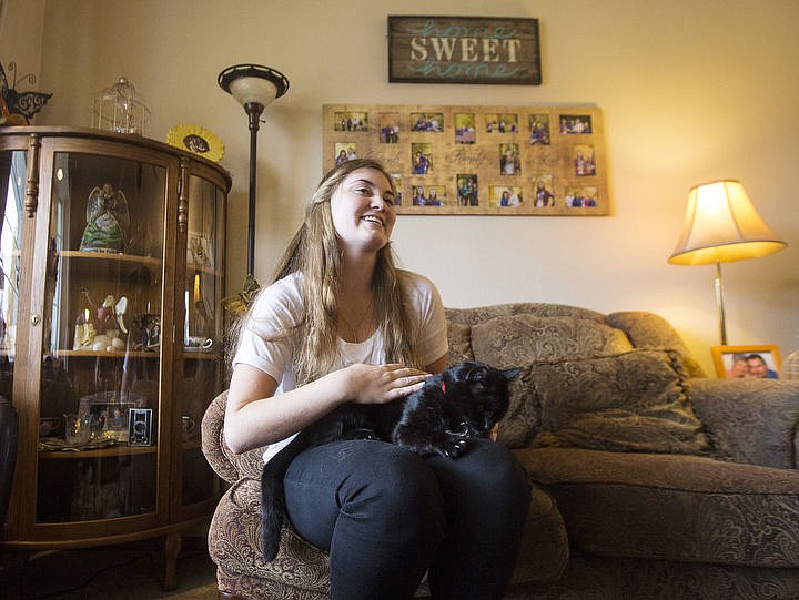 &lt;p&gt;Gracie Kingsley holds and pets her 4-year-old Bombay cat, Catniss, at her home on Monday, Oct. 17, 2016 after her cat had been gone for nearly five months.&lt;/p&gt;