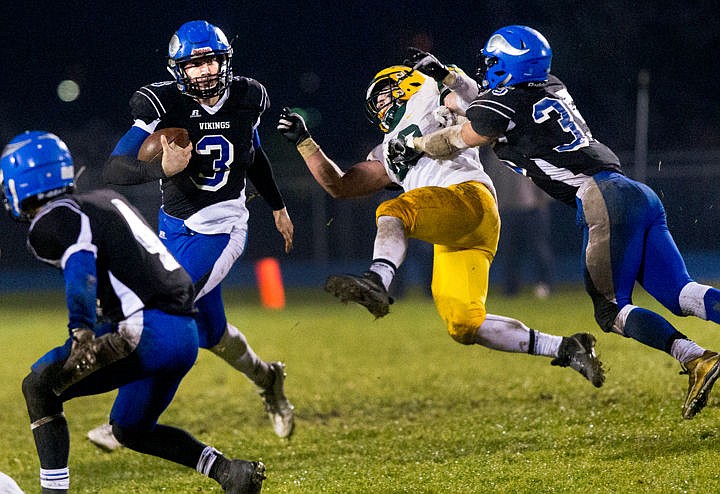 &lt;p&gt;Coeur d'Alene junior wide reciever Ross Chadderdon (35) lights up Lucas Langus of Borah as Coeur d'Alene junior quarterback Cole Yankoff (3) sprints by on Friday, Oct. 28, 2016 at Coeur d'Alene High School.&lt;/p&gt;