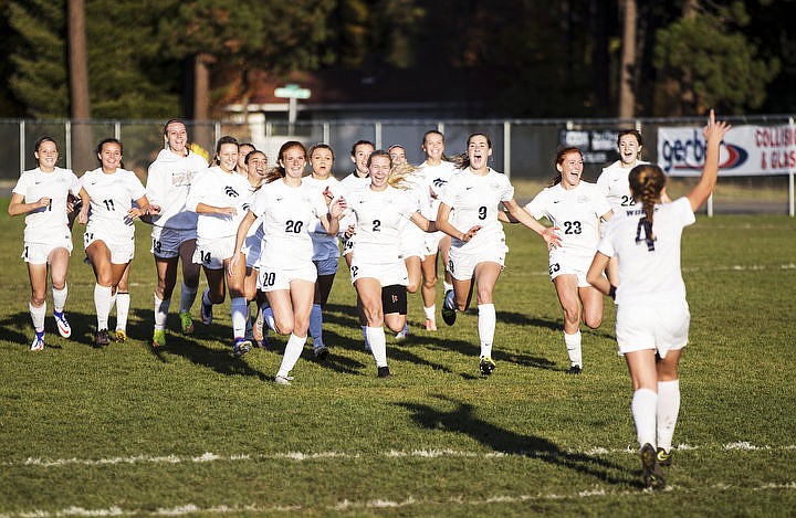 &lt;p&gt;Lake City High girls soccer team members rush toward Chloe Teets (4) to celebrate after she scored the game-winning penalty kick in a shootout on Saturday, Oct. 22, 2016 at the state 5A girls soccer championship title game against Rocky Mountain at Coeur d&#146;Alene High.&lt;/p&gt;