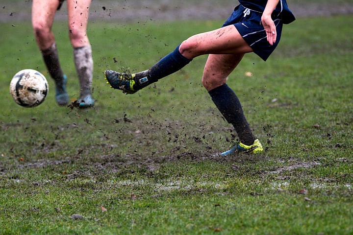 &lt;p&gt;A Spokane women's player kicks through the mud to get a pass off during a match-up with North Idaho on Wednesday, Oct. 26, 2016 at North Idaho College.&lt;/p&gt;