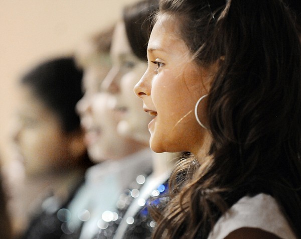 &lt;p&gt;Fifth-grader Trinity Lee sings with other students at Peterson
School Friday morning in the sixth annual Olweus Bullying
Prevention Program assembly. At top, students raise signs they made
for Bullying Prevention Rule 2: &#147;We will help students who are
bullied.&#148; Different grades were asked to makes signs for one of the
four rules. The other three rules are, 1) We will not bully others;
3) We will include students who are easily left out; and 4) We will
tell an adult at school and an adult at home when we know someone
is being bullied.&lt;/p&gt;