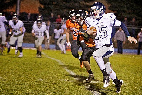 &lt;p&gt;Lake City High's Mitch Bevacqua breaks past the Post Falls defense on his way to the end zone.&lt;/p&gt;