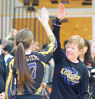 <p>Libby High coach Cindy Ostrem-Johnston 'high 5s' sophomore Linsey Walker prior to the District 7B championship Saturday night. (Caleb M. Soptelean/TWN)</p>