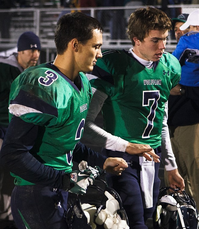 <p>Patrick Cote/Daily Inter Lake Glacier senior wide receiver Kyle Griffith (3) and Glacier senior quarterback Taylor Hulslander (7) talk Friday night after Glacier's playoff victory over Helena Capital at Legends Stadium. Friday, Nov. 2, 2012 in Kalispell, Montana.</p>