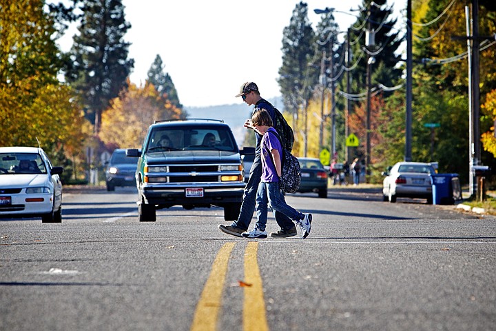 &lt;p&gt;JEROME A. POLLOS/Press Daniel Gordon, 12, foreground, and Cody Shaw, 15, pass by the intersection of Spokane Street and 15th Avenue on their way to the Post Falls Library after school Tuesday. The city of Post Falls is seeking public comment on a bicyclist and pedestrian improvement plan that recently was developed.&lt;/p&gt;