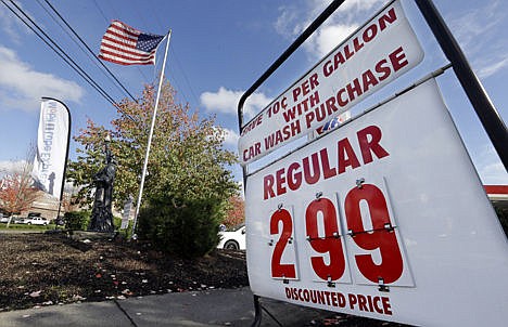 &lt;p&gt;An American flag flies at a gas station advertising a discounted price for gas at $2.99 per gallon, with the purchase of a car wash, in Lynnwood, Wash., on Wednesday.&#160;&lt;/p&gt;