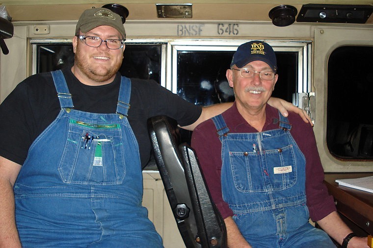 Mark McManus of Whitefish poses for a photo with his son Keith, the fourth generation of the McManus family that has worked on the railroad, as they travel through the night from Havre to Whitefish during Mark&#146;s last shift before retirement.