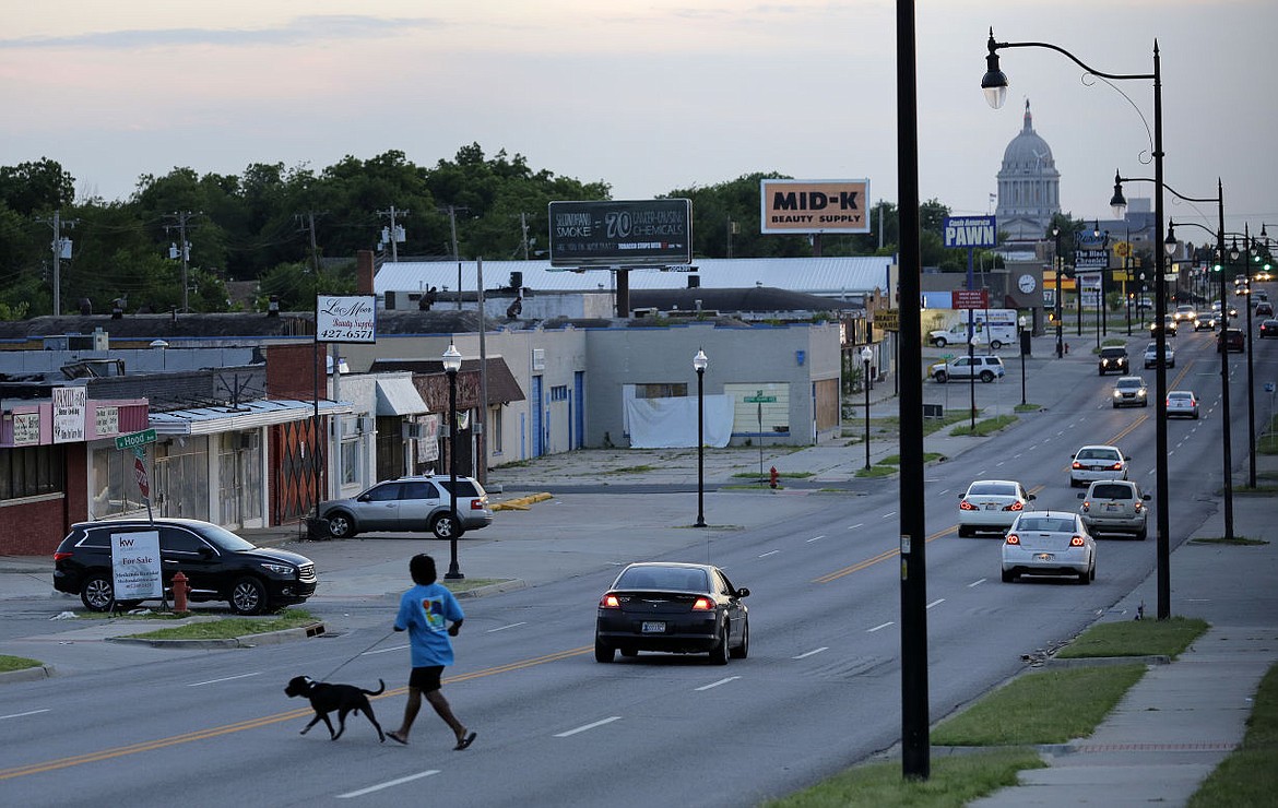 &lt;p&gt;ADVANCE FOR USE ON SUNDAY NOV. 1 - Traffic and pedestrians move along NE 23rd Street in Oklahoma City on June 10, 2015, in a neighborhood where several woman say they were sexually assaulted by Oklahoma City police officer Daniel Holtzclaw. A yearlong Associated Press investigation illuminated the problem of rape and sexual misconduct committed by law officers in the United States, uncovering about 1,000 officers who lost their licenses from 2009 to 2014 for such incidents. (AP Photo/Eric Gay)&lt;/p&gt;