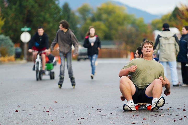 &lt;p&gt;SHAWN GUST/Press Chantz Floyd, 17, steadily creeps a skateboard along the pavement using his heels Wednesday during the Genesis Prep Academy's Roll-a-thon fundraising event at Real Life Ministries in Post Falls. Students collected donations and pledge amounts for the event where they rolled on bicycles, roller blades, scooters and skateboards for a 20-minute periods of time. The proceeds will be used for technology improvements in the classroom.&lt;/p&gt;