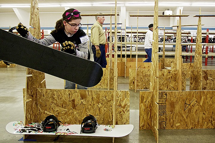 &lt;p&gt;JEROME A. POLLOS/Press Logan Ward arranges youth snowboards Thursday as she helps prepare for the 14th annual Winter Swap sponsored by Silver Mountain and Lookout Pass' ski patrols being held Saturday. The event is scheduled from 9 a.m. to 3 p.m. Individuals wanting to sell items must bring their winter gear cleaned and in good condition to the Kootenai County Fairgrounds today from 3 - 8 p.m.&lt;/p&gt;