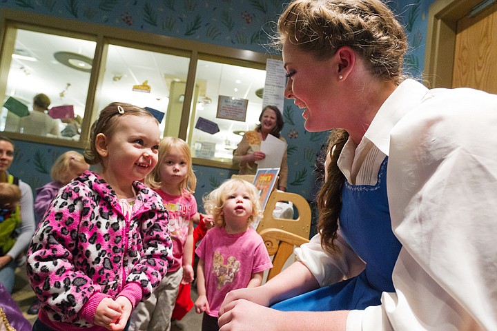 &lt;p&gt;SHAWN GUST/Press Averie Morin, 3, visits with Kalla Mort, who plays Belle in the Christian Youth Theater's production of &quot;Beauty and the Beast,&quot; following a book reading Tuesday at the Coeur d'Alene Public Library. The play will be performed at the Kroc Center November 1 through 11. Alexis Bartlett, 4, and her sister Zoey, 2, second from right, look on.&lt;/p&gt;