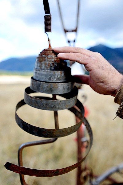 <p>Sean Guerrero demonstrates how one of his mobile structures bends and moves on Wednesday, October 17, near Creston.</p>