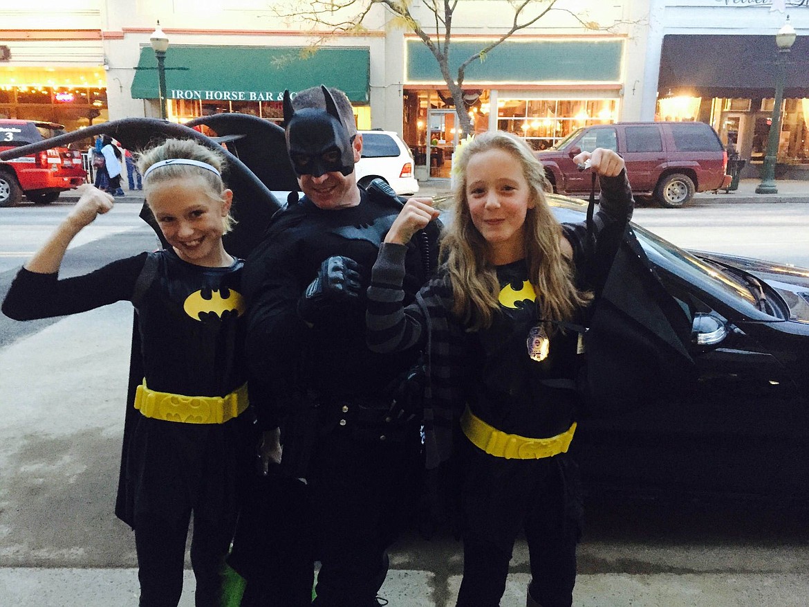 &lt;p&gt;The Halloween Caped Crusader posing on Sherman Avenue is Kootenai County Sheriff's Deputy Scot Hice, flanked by Bat Girls&#160;Ainsley Brigham (left) and Kylie Stone. And yes, that's the deputy's Batmobile in the background. This is our secret, readers. Don't tell the Joker!&lt;/p&gt;